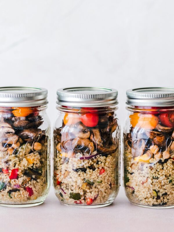 Colorful quinoa salad mason jars with roasted veggies, ideal for healthy meal prep.