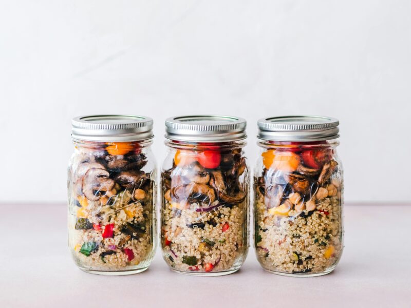 Colorful quinoa salad mason jars with roasted veggies, ideal for healthy meal prep.