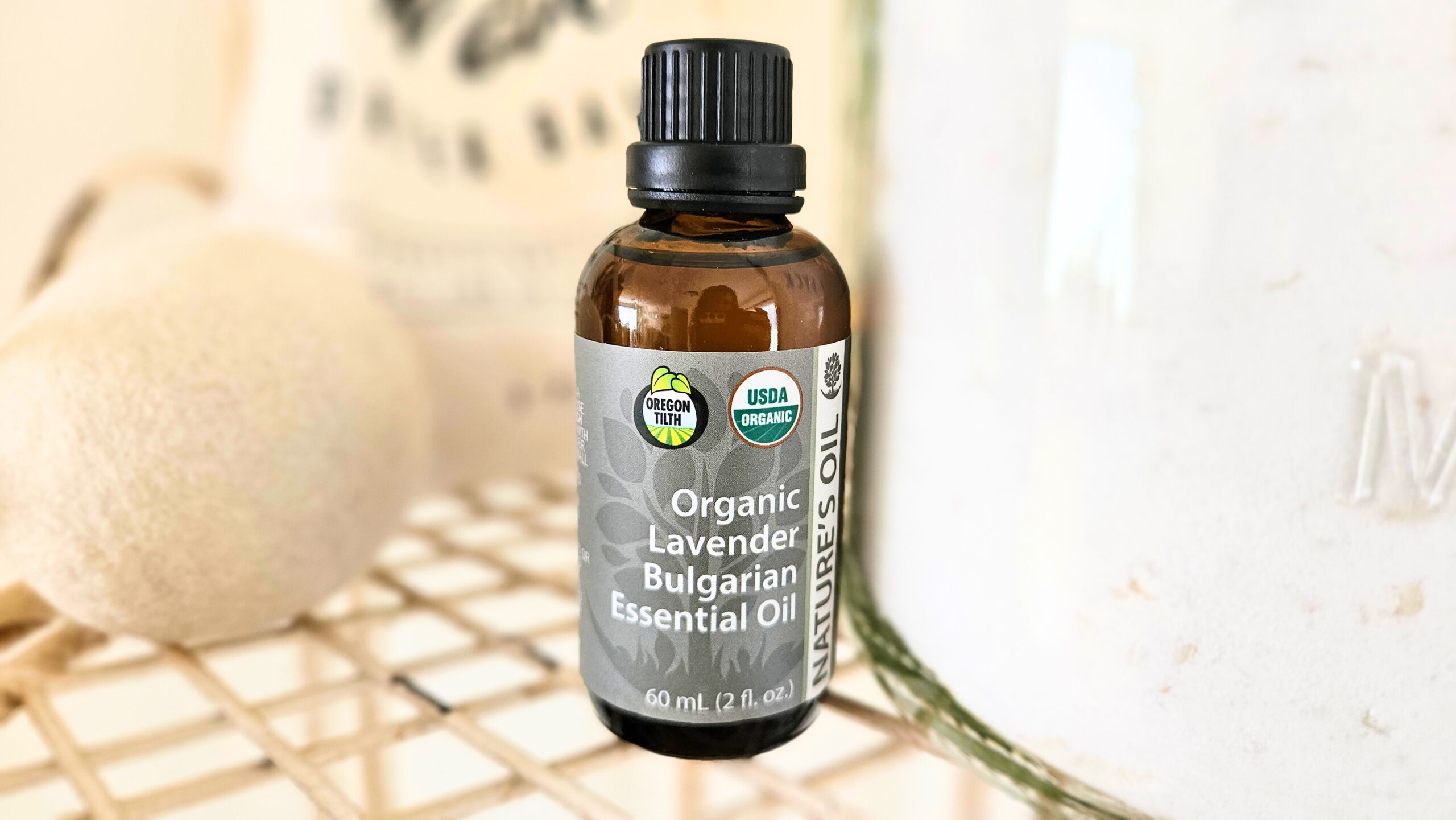 A brown glass bottle of organic lavender essential oil.