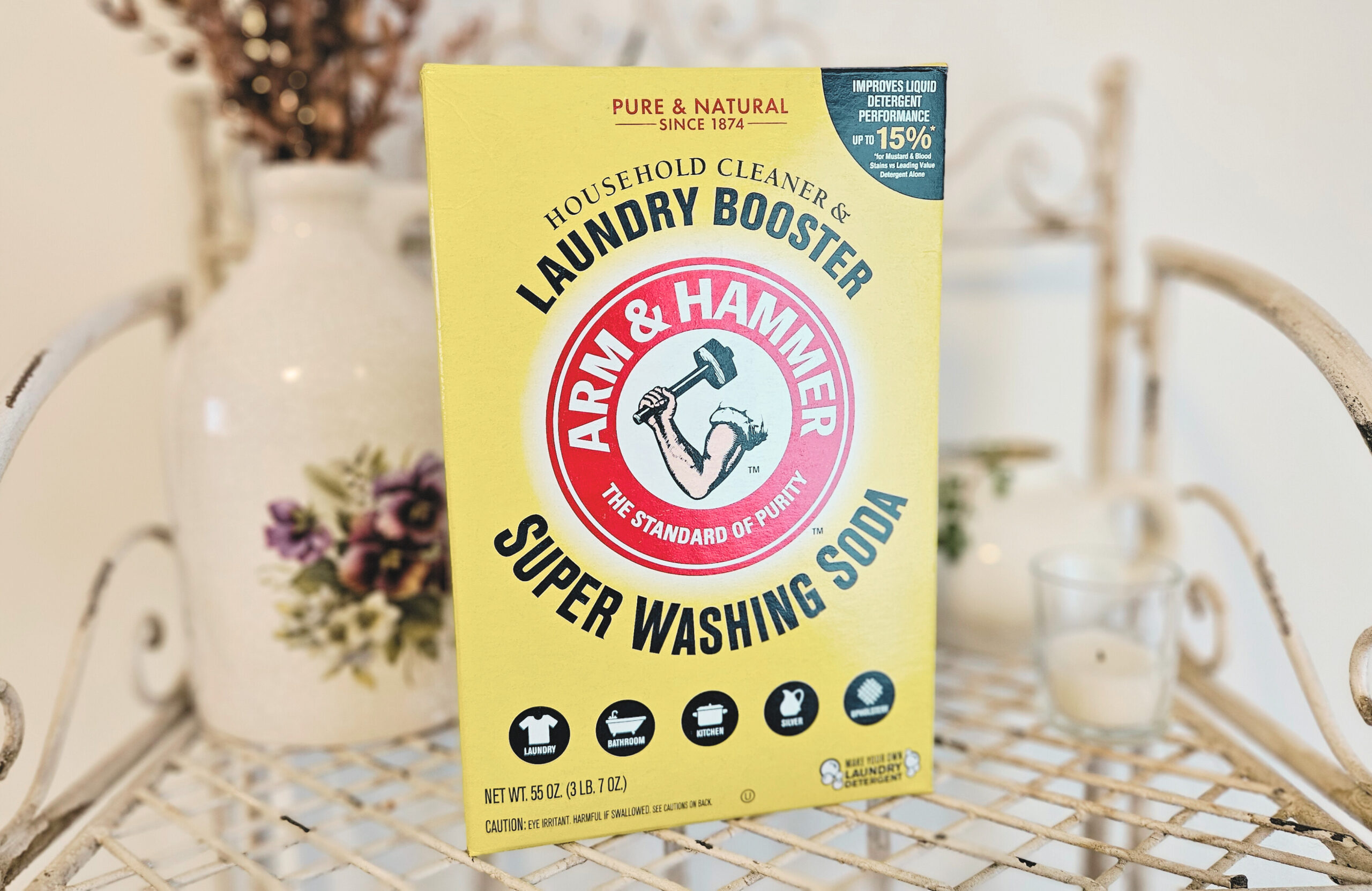 A box of washing soda sitting on a metal shelf.