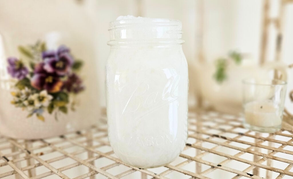 Pint jar of thick white liquid laundry detergent.