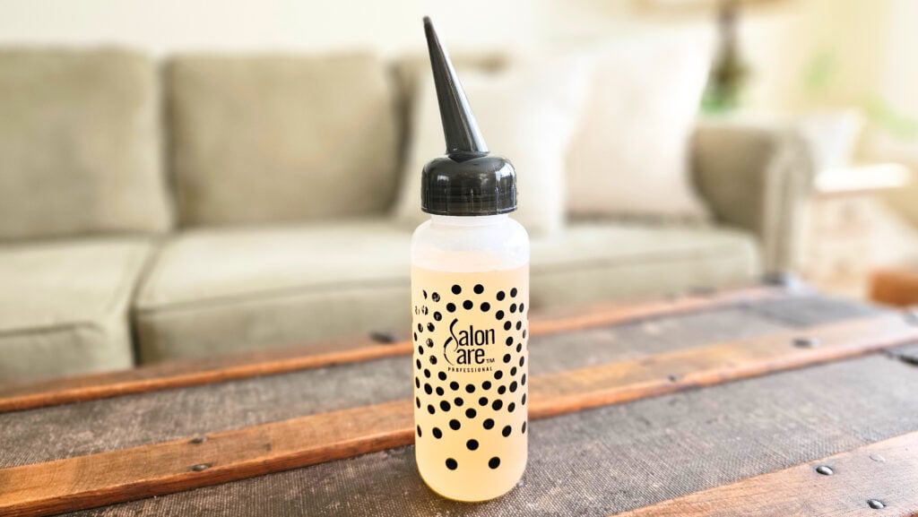 Bottle of apple cider vinegar hair and scalp rinse.